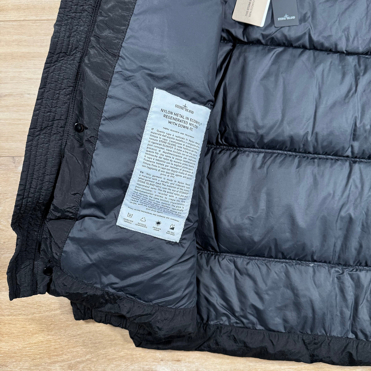 Stone Island Nylon Metal Down Jacket in Black Castmark