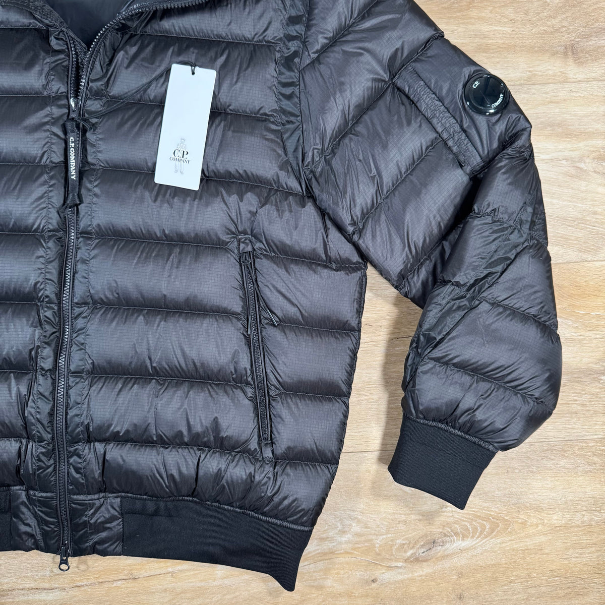 CP Company DD Shell Lens Down Jacket in Black Castmark