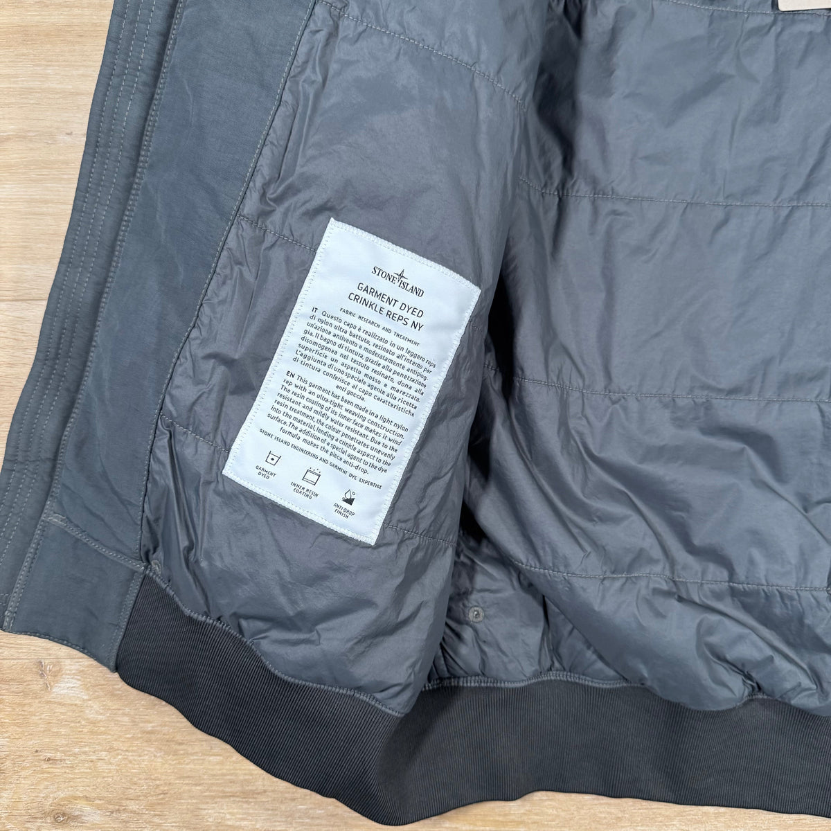 Stone Island Crinkle Reps NY Padded Jacket in Lead Grey Castmark