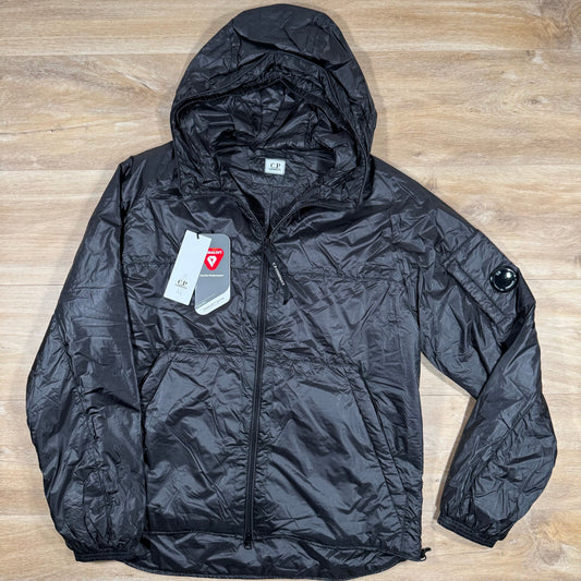 CP Company Nada Shell Lens Padded Jacket in Black Castmark