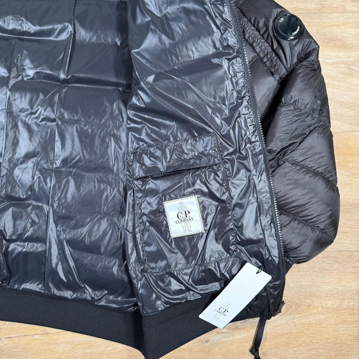 CP Company DD Shell Lens Down Jacket in Black Castmark