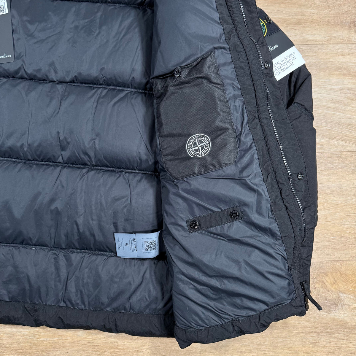 Stone Island Nylon Metal Down Jacket in Black Castmark
