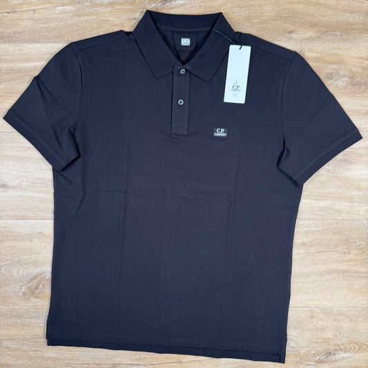 CP Company Stretch Piquet Logo Polo Shirt in Black Castmark