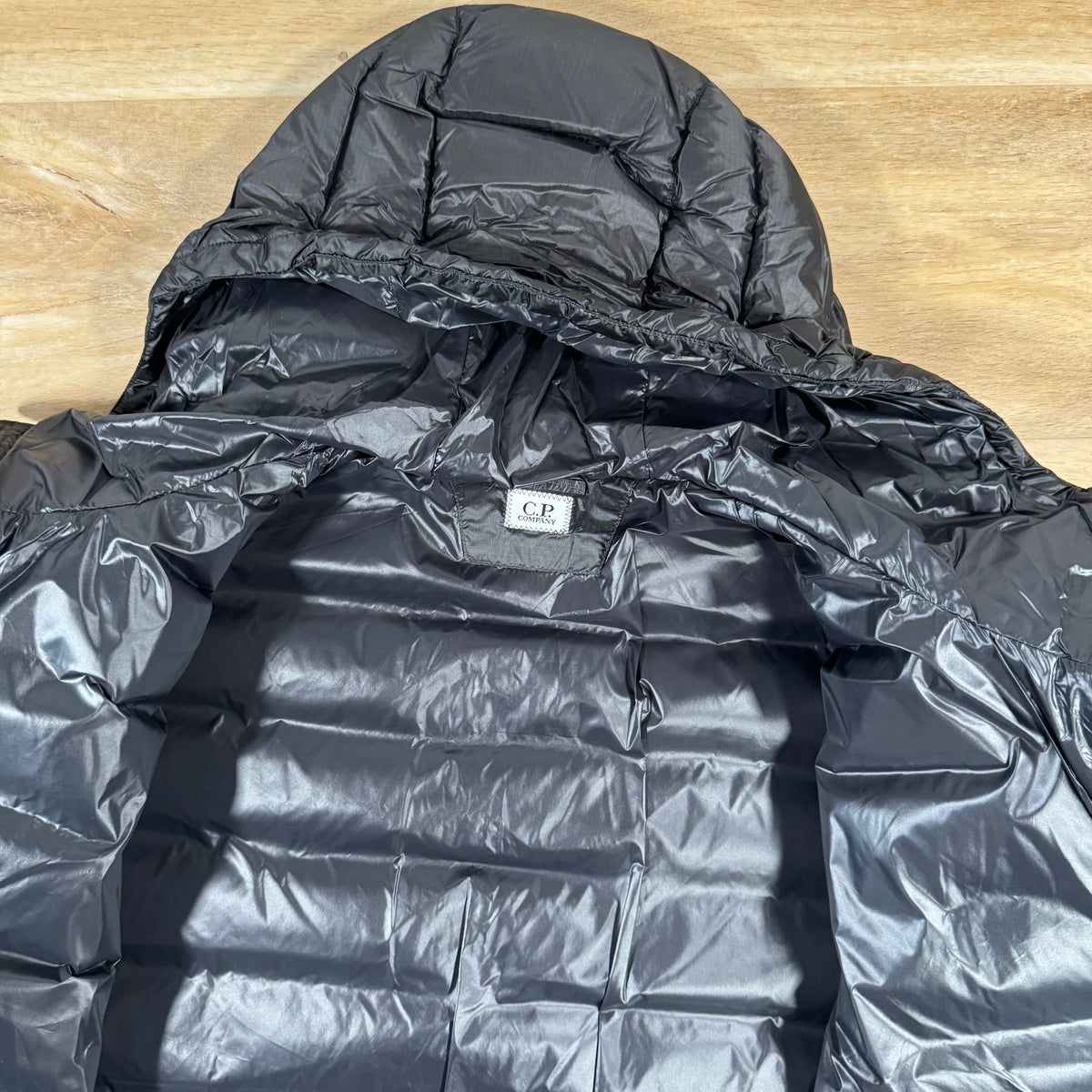 CP Company DD Shell Lens Down Jacket in Black Castmark