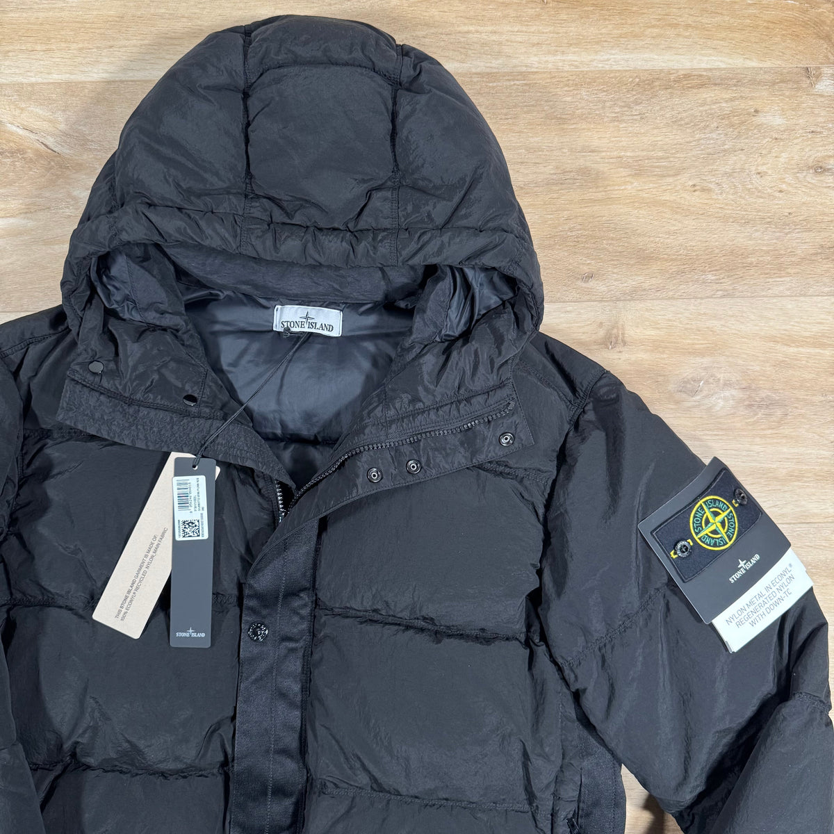 Stone Island Nylon Metal Down Jacket in Black Castmark
