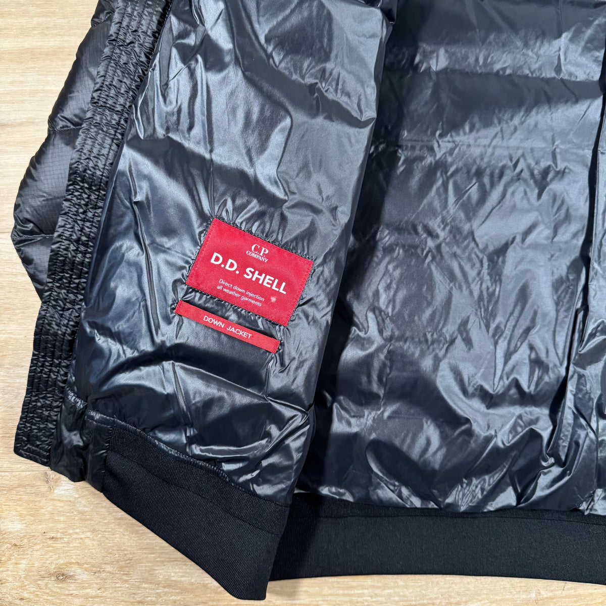 CP Company DD Shell Lens Down Jacket in Black Castmark