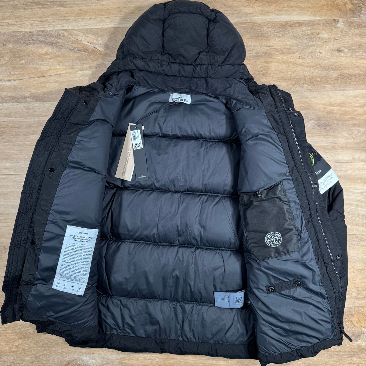 Stone Island Nylon Metal Down Jacket in Black Castmark
