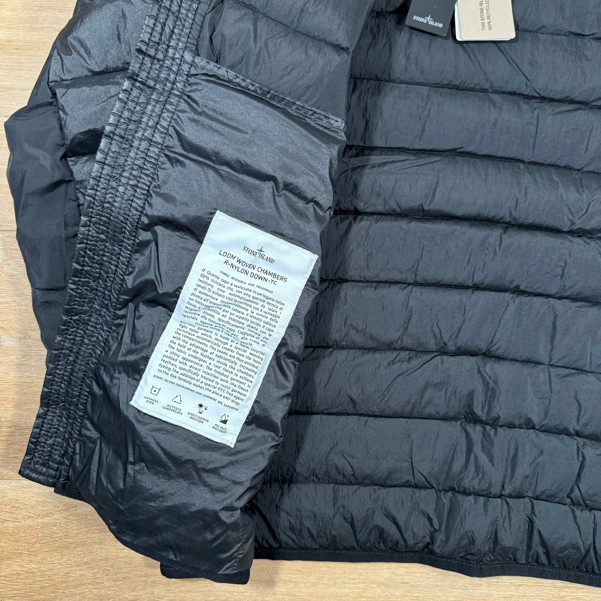 Stone Island Loom Woven Chambers Nylon Down-TC Jacket in Black Castmark
