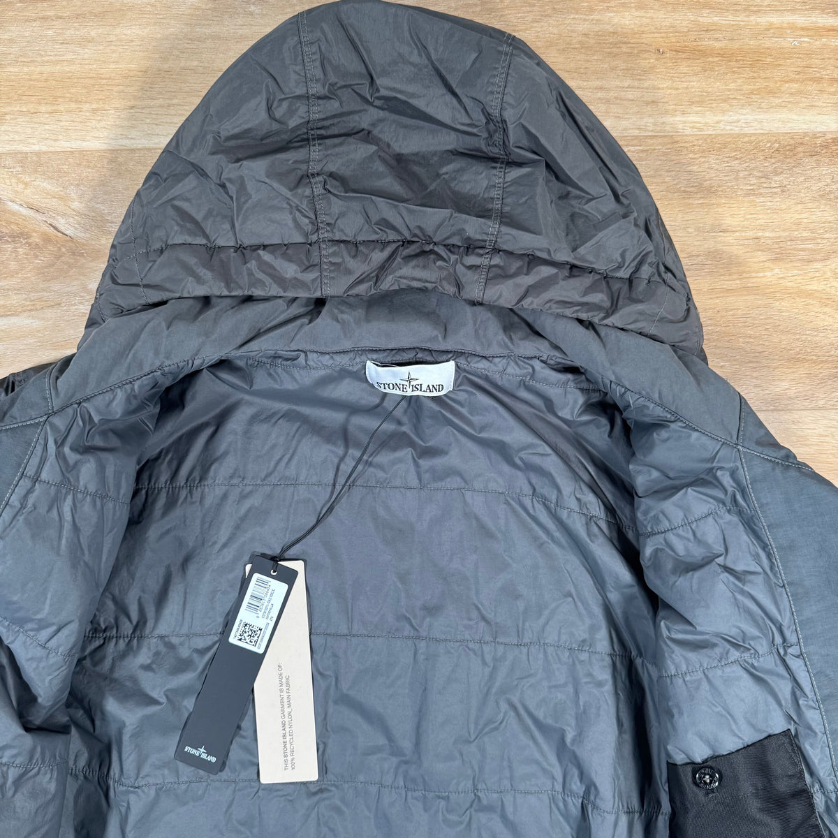 Stone Island Crinkle Reps NY Padded Jacket in Lead Grey Castmark