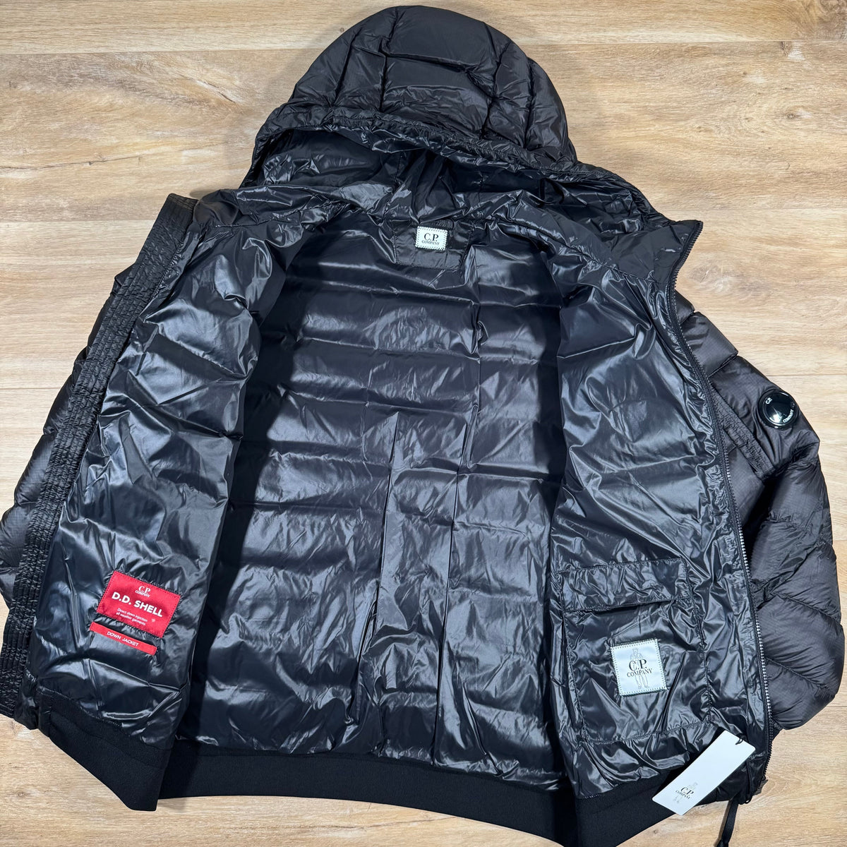 CP Company DD Shell Lens Down Jacket in Black Castmark