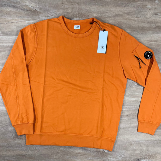 CP Company Light Fleece Crewneck Lens Sweatshirt in Russet Orange Castmark