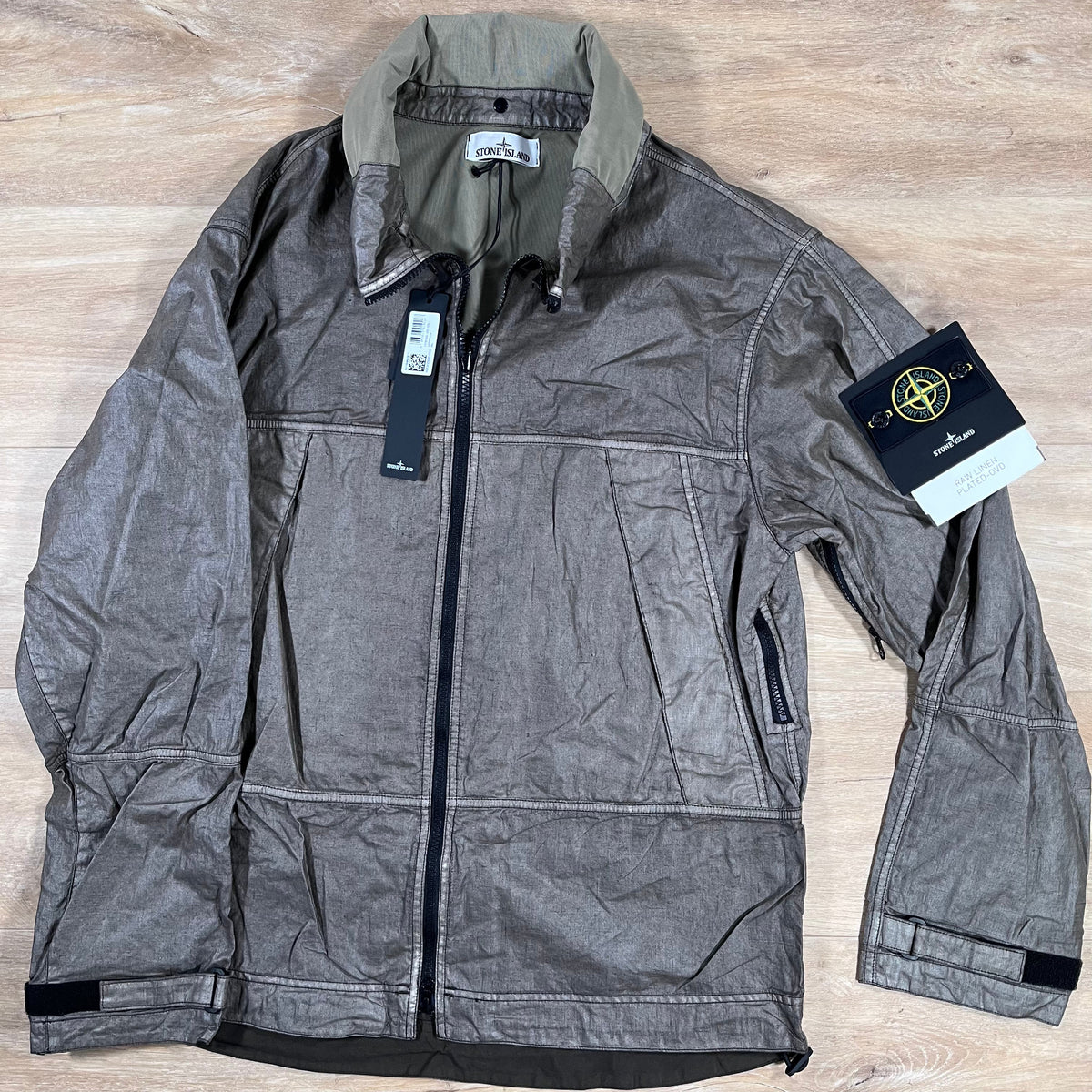 Stone Island Raw Linen Plated-OVD Jacket in Military Green Castmark