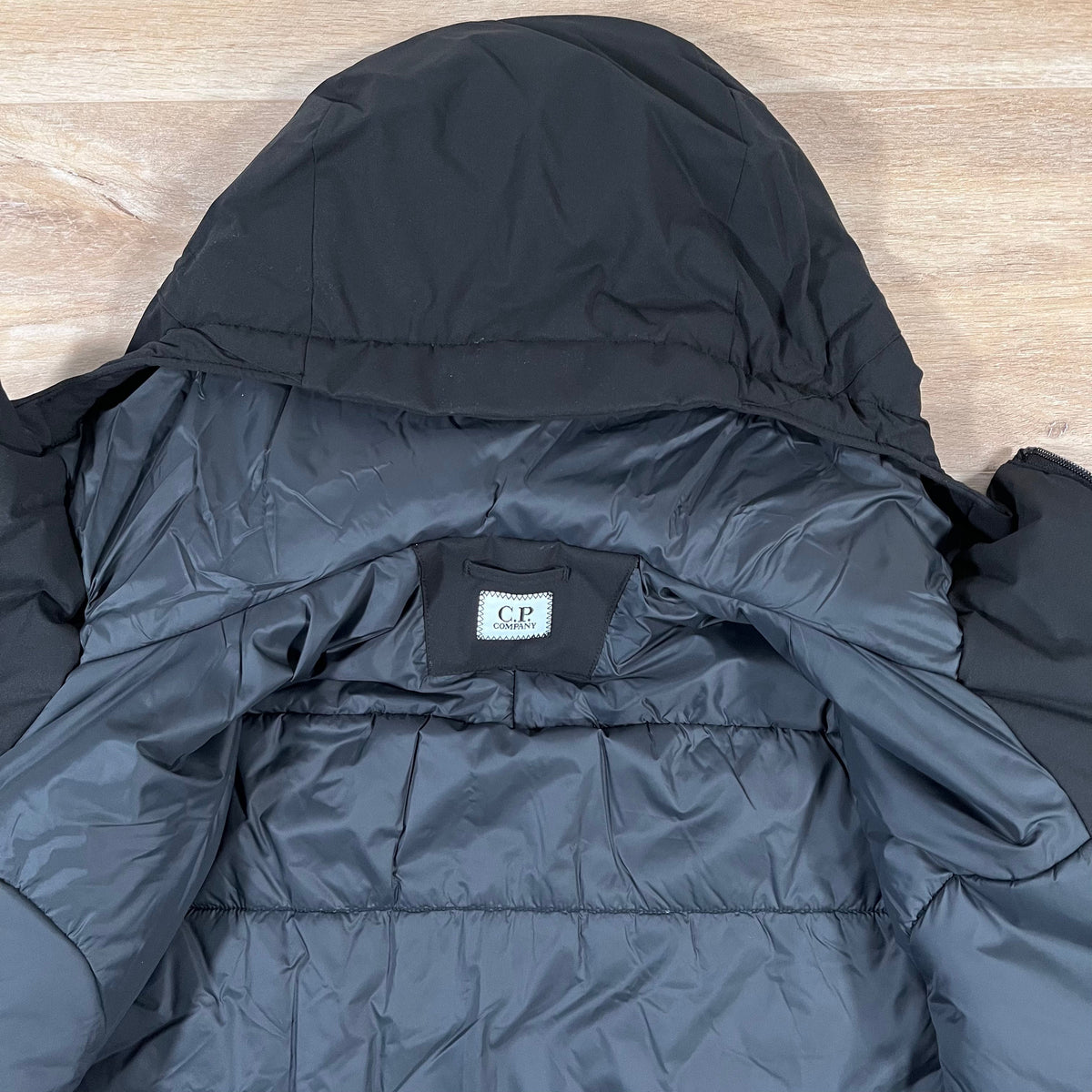 CP Company Pro-Tek Padded Lens Jacket in Black Castmark