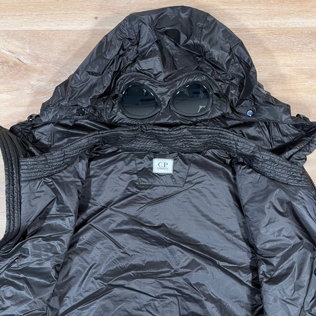 CP Company Nada Shell Goggle Padded Gilet in Black Castmark