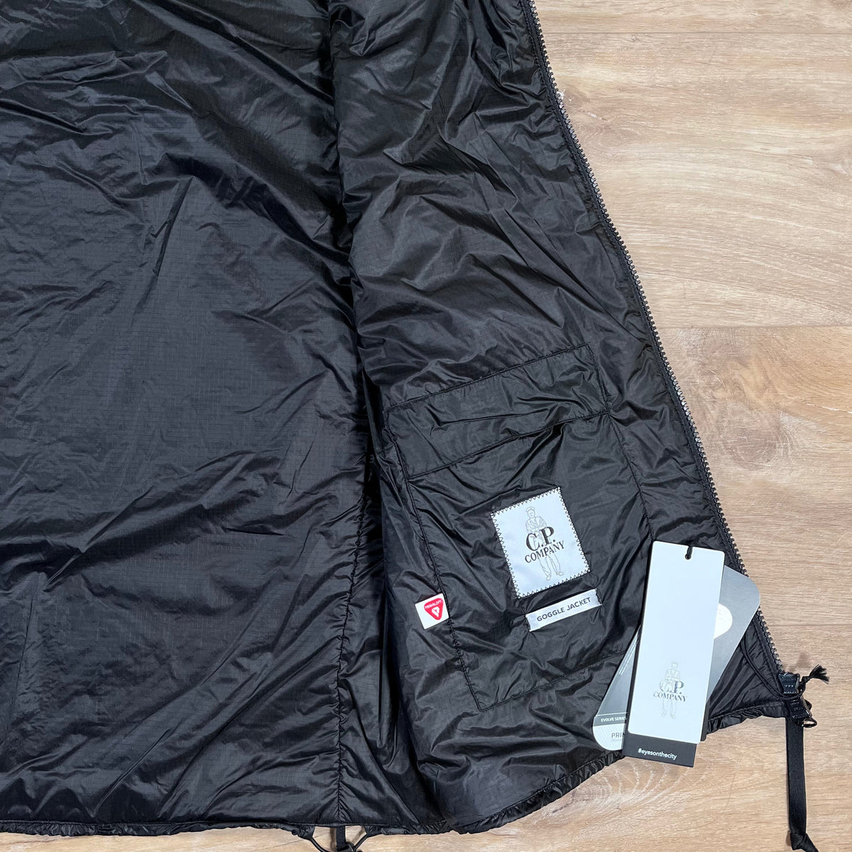 CP Company Nada Shell Goggle Padded Gilet in Black Castmark